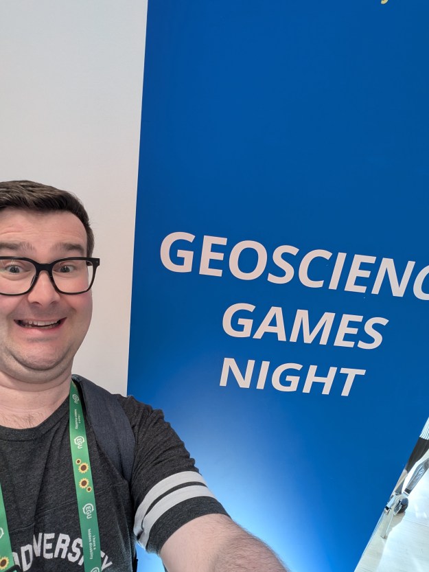 A selfie of me in front of the Geoscience Games Night sign.